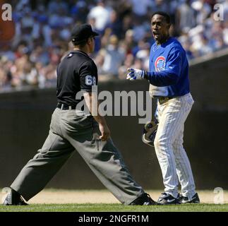 Chicago Cubs' Kenny Lofton, right, has words for second base