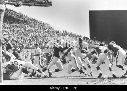 Larry Csonka (39) Miami running back smashes through center for five yards  during second period action against the Minnesota Vikings during Super Bowl  VIIII in Houston, Texas Jan. 13, 1974. Paul Krause (