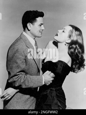 Actor John Garfield and actress Hazel Brooks pose in a scene from the boxing drama 'Body and Soul,' in August 1947.