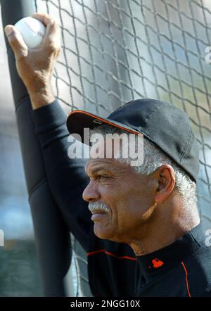 San Francisco Giants' new right fielder Moises Alou, left, listens to his  father, Giants' manager Felipe Alou, right, during spring training at  Scottsdale Stadium in Scottsdale, Ariz., Wednesday Feb. 23, 2005. .(AP