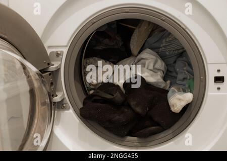 clean things in the washing machine in the bathroom close up Stock Photo