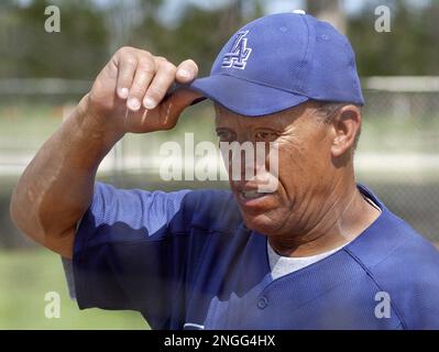 National Baseball Hall of Fame member Ryne Sandberg tips his cap to the  crowd as he is introduced before playing in Play Ball with Ozzie, at  Doubleday Field in Cooperstown, New York