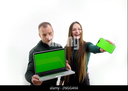 monitor chroma key male female show rear view Couple Connecting green screen Television Channel Through Wifi On Digital Tablet. High quality photo Stock Photo