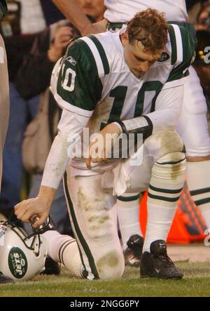 New York Jets head Chad Pennington throws a pass over a leaping Miami  Dolphins Jason Taylor in the first quarter at Giants Stadium in East  Rutherford, New Jersey on October 15, 2006.