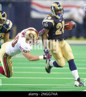 St. Louis Rams Marshall Faulk watches the action from the