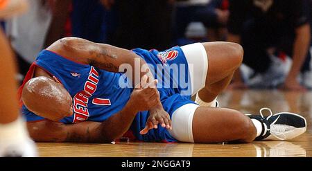 Detroit Pistons' Chauncey Billups lies on the court with an injury in the first half against the New York Knicks, Monday, Nov. 18, 2002, in New York. (AP Photo/Mark Lennihan)