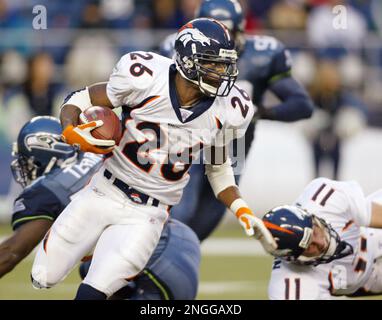 Denver Broncos' Clinton Portis runs for five yards against the Seattle  Seahawks during the fourth quarter in Seattle Sunday Nov. 17, 2002. Portis  rushed for 136 yards and and added another 56