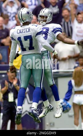 Quarterback Quincy Carter, of the Dallas Cowboys, drops back with a fake  hand off, before throwing theball down field, in the 1st quarter, as the  Dallas Cowboys face the New England Patriots,