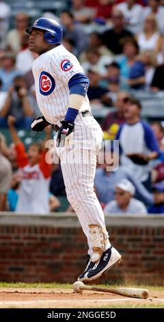 Chicago Cubs' Sammy Sosa follows through on his ninth home run of the  season in the fourth inning against the San Diego Padres Wednesday May 1,  2002, in San Diego. (AP Photo/Lenny