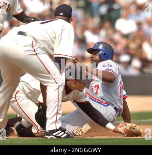 Montreal Expos Vladimir Guerrero (27) celebrates with teammate Brian  Schneider after hitting a three-run home run off San Diego Padres pitcher  Jaret Wright to beat the Padres 12-9 in 10 innings, in