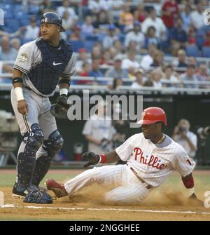 Philadelphia Phillies' Bobby Abreu slides home for an inside-the-park homer  against the New York Mets in the second inning Friday, May 14, 1999 in  Philadelphia. (AP Photo/ George Widman Stock Photo 