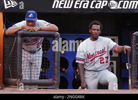 Montreal Expos Vladimir Guerrero (27) celebrates with teammate Brian  Schneider after hitting a three-run home run off San Diego Padres pitcher  Jaret Wright to beat the Padres 12-9 in 10 innings, in