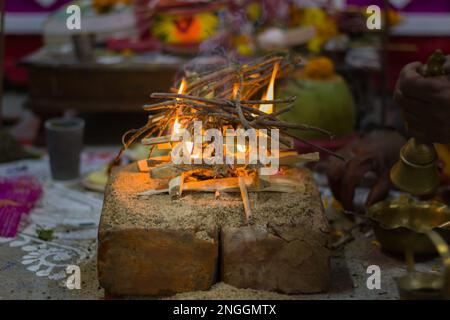 Hindu pooja ritual yagya or yajna, which is fire ceremony performed during marriage, puja and other religious occasions as per vedic traditions of sac Stock Photo