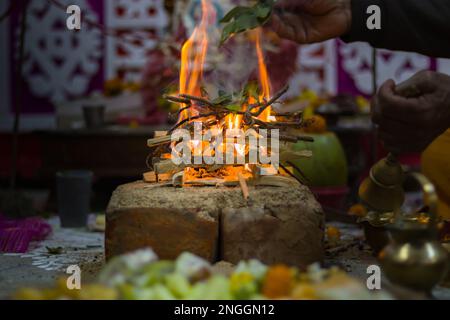 Hindu pooja ritual yagya or yajna, which is fire ceremony performed during marriage, puja and other religious occasions as per vedic traditions of sac Stock Photo