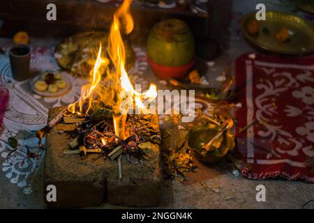 Hindu pooja ritual yagya or yajna, which is fire ceremony performed during marriage, puja and other religious occasions as per vedic traditions of sac Stock Photo