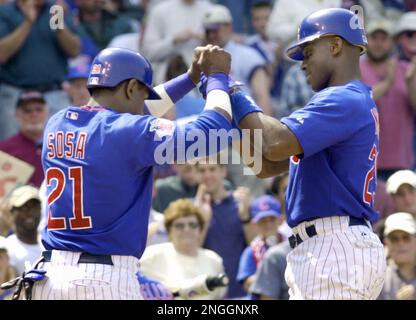 Chicago Cubs Sammy Sosa (R) is congratulated by teammates Mark