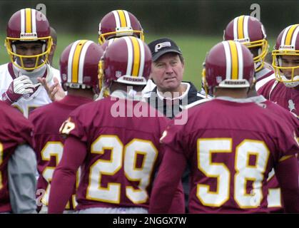 Washington Redskins head coach Steve Spurrier chats with wide receiver  Darnerien McCants in the final practice shortly before the kickoff of the  NFL preseason match American Bowl against the San Francisco 49ers