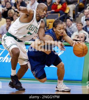 New Jersey Nets' Stephon Marbury (33) drives toward Boston Celtics' Kenny  Anderson (7) and Vitaly Potapenko, left, during the first quarter Friday,  Feb. 4, 2000, in Boston. (AP Photo/Lisa Poole Stock Photo - Alamy