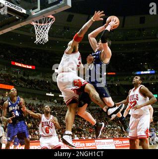 Chicago Bulls forward Marcus Fizer, left, fights off Milwaukee Bucks center  Daniel Santiago for a fourth-quarter slam dunk Friday, March 26, 2004, at  the United Center in Chicago. The Bucs went on