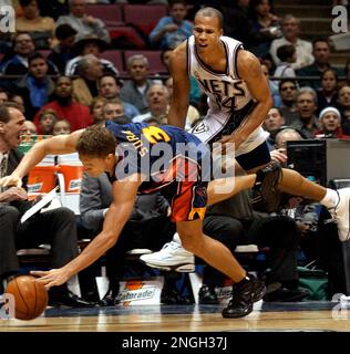 Golden State Warriors' Bob Sura (3) beats New Jersey Nets' Richard  Jefferson to a loose ball during the second quarter Tuesday night, Feb. 19,  2002, in East Rutherford, N.J. Jefferson was called for a foul for pushing  Sura from behind. (AP Photo/Bill