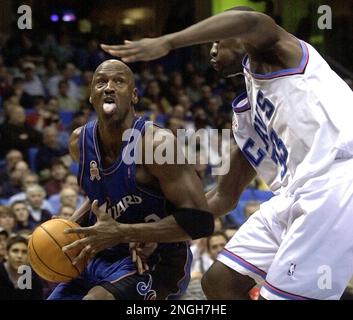 Washington Wizards' Michael Jordan, left, drives past New Jersey