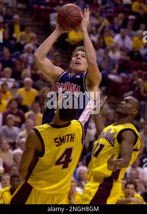 Arizona forward Luke Walton, right, grabs the rebound away from Stanford  forward Justin Davis in the second half, Saturday, March 1, 2003 in  Stanford, Calif. Arizona defeated Stanford 72-69 to win the