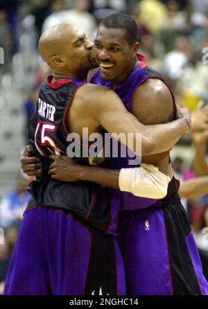 Vince Carter and Hakeem Olajuwon of the Toronto Raptors pose for a