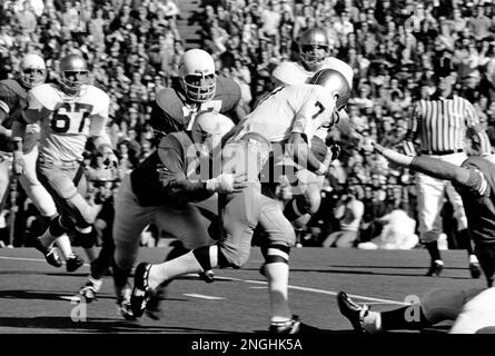 Notre Dame's All American quarterback Joe Theismann breaks away from a  University of Texas tackler as he goes in to score from the three yard line  in the Cotton Bowl game in Dallas, Texas on Jan. 1, 1971. Bill Atessis  (77), Texas left end, races in to 