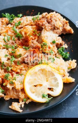 Seitan and rice pilaf with sweet paprika and lemon, adapted from a traditional greek recipe. Stock Photo