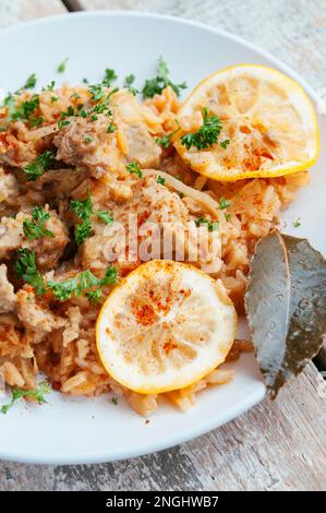 Seitan and rice pilaf with sweet paprika and lemon, adapted from a traditional greek recipe. Stock Photo