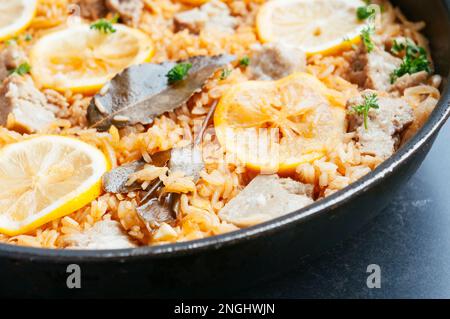 Seitan and rice pilaf with sweet paprika and lemon, adapted from a traditional greek recipe. Stock Photo