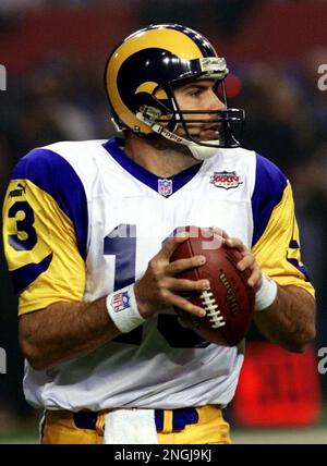 JANUARY 30 2000: Rams quarterback Kurt Warner (13) tries to avoid Titans  defense end Jevon Kearse as the St. Louis Rams defeated the Tennessee  Titans 23-17 to win Super Bowl XXXIV at