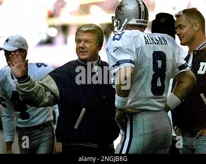 Miami Dolphins running back Terry Kirby (43) fumbles under pressure from  Dallas Cowboys Brock Marion (31), Bill Bates (40) and Leon Lett (78) in the  first quarter in Irving, Texas, Nov. 25