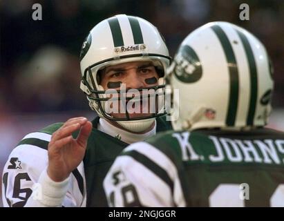 New York Jets' Keyshawn Johnson (19) gets hugged by teammates