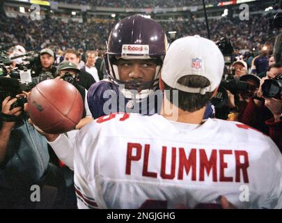 Minnesota Vikings quarterback Randall Cunningham waves to someone in the  crowd after their 41-2 …