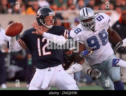 Chicago Bears lineman Andy Heck, middle, provides protection for