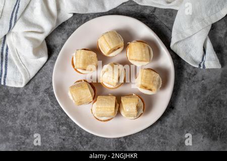 Banana tartlet. Delicious tartlet dessert on plate. Top view Stock Photo