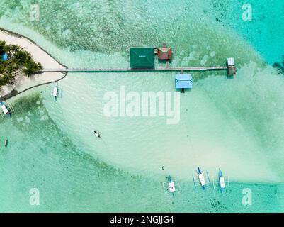 Tropical island on an atoll with a beautiful beach. Onok Island, Balabac, Philippines. Stock Photo