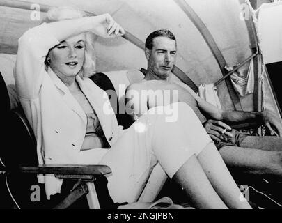 Marilyn Monroe and Joe DiMaggio in Florida, 1961. (Note the neon