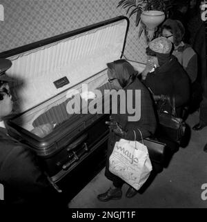 The body of black nationalist leader Malcolm X, covered with a