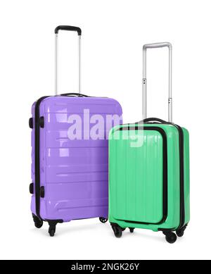 Stylish suitcases packed for travel on white background Stock Photo
