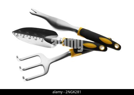 Trowel, weeder and pitchfork on white background, top view. Gardening tools Stock Photo