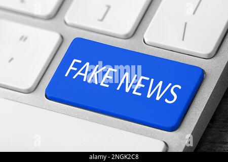Modern computer keyboard with text FAKE NEWS on button, closeup Stock Photo