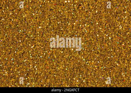 Gold and bronze glitter color confetti dots splash on white. Abstract glow shine background. Stock Photo
