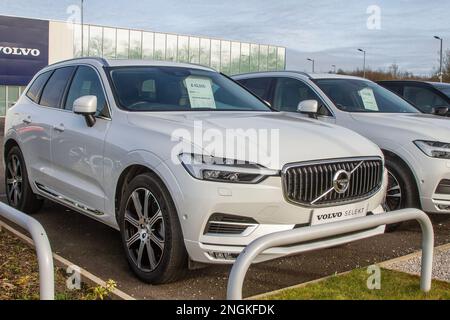 2020 White Volvo XC60 SUV; New and used cars are displayed for sale on car dealers' forecourts & showrooms. Stock Photo