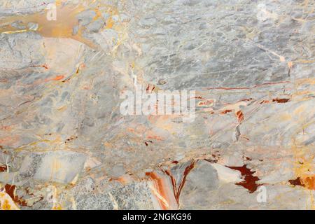 Natural stone, grey marble with golden veins. Stock Photo