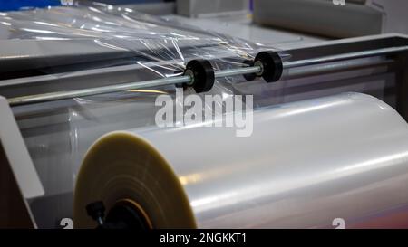 Conveyor Belt For Packaging In Transparent Polythene Stretch. Concept Of Industrial Technologies And Packaging Materials. Stock Photo