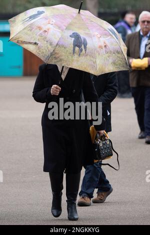 Ascot, Berkshire, UK. 18th February, 2023. Racegoers arriving at Ascot Racecourse for a busy day of horse racing at the Betfair Chase Raceday on a dull day with light drizzle. Credit: Maureen McLean/Alamy Live News Stock Photo