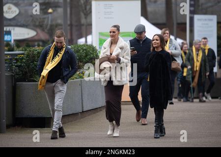 Ascot, Berkshire, UK. 18th February, 2023. Racegoers arriving at Ascot Racecourse for a busy day of horse racing at the Betfair Chase Raceday on a dull day with light drizzle. Credit: Maureen McLean/Alamy Live News Stock Photo