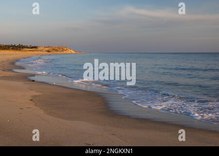 Waves gently lapping the shore at Herring Point, Cape Henlopen State Park near Lewes, Delaware Stock Photo